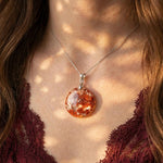 Autumn Canopy Garden Quartz pendant on model, crimson gold forest inclusions