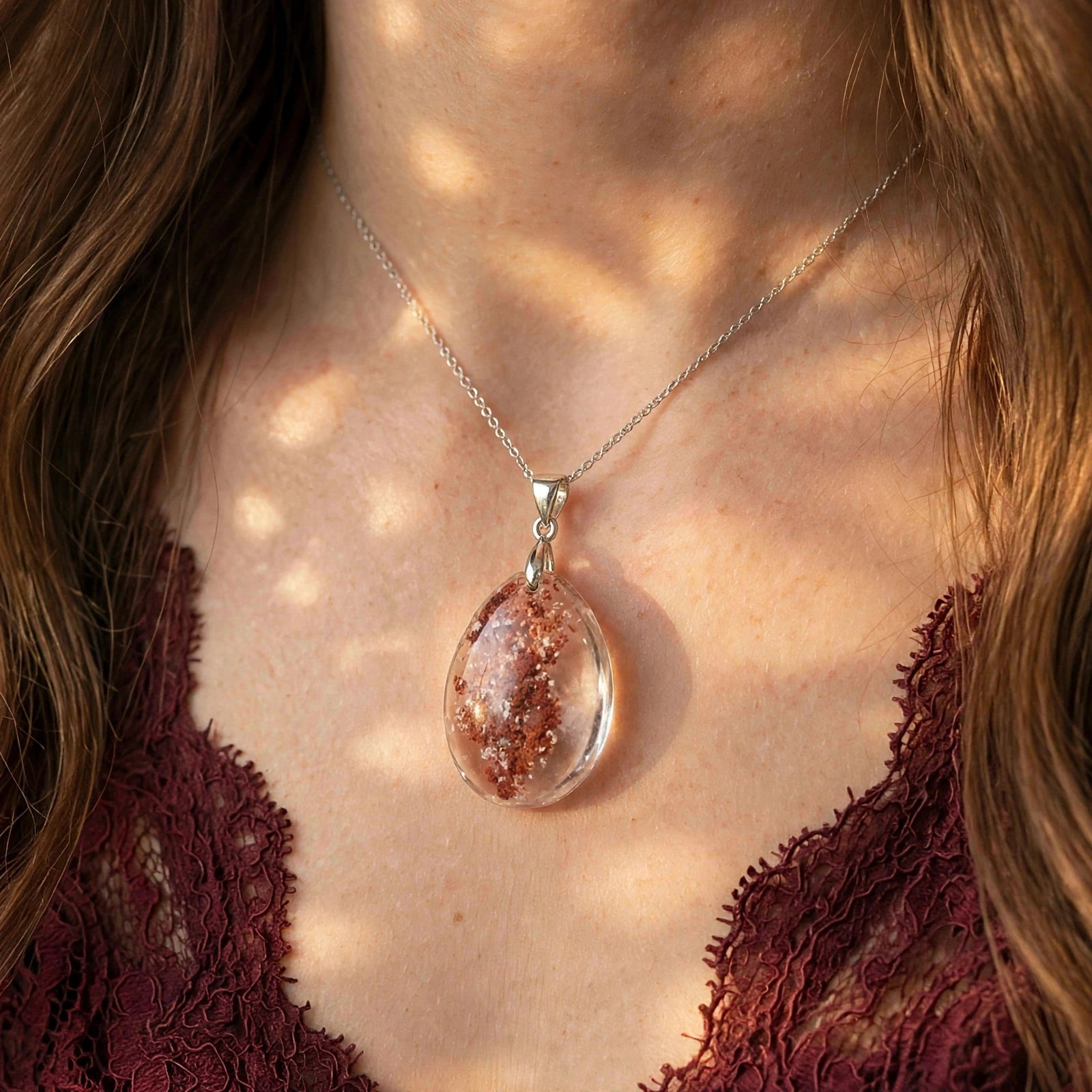 Scarlet Canopy Garden Quartz pendant on model, bold crimson forest inclusions