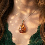 Crimson Ember Garden Quartz pendant on model, 18K white gold vermeil